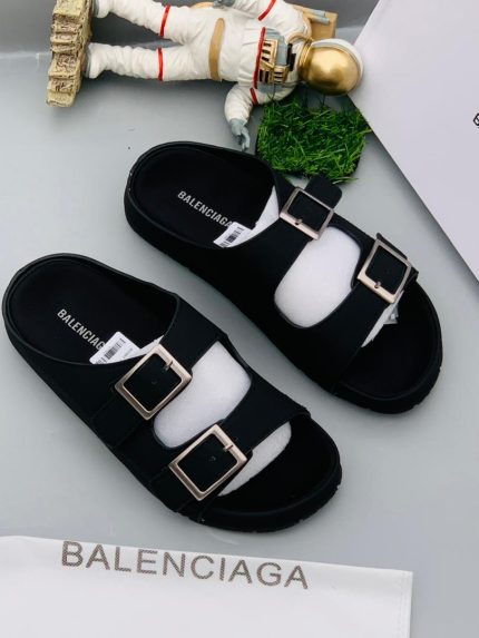 Sneakers, loafers, or slip-on sandals in black, showcasing the brand's signature style and quality.